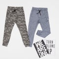 Fashion - clothes two sports pants for young; photo in neutral background