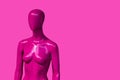 Fashion clothing store human female mannequin pink onbackground, monochrome style.
