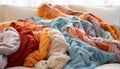 Fashion collection vibrant, multi colored clothing stack in modern bedroom generated by AI Royalty Free Stock Photo