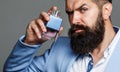 Fashion cologne bottle. Bearded male prefers expensive fragrance smell. Man perfume, fragrance. Male fragrance and