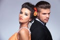 Fashion couple back to back looking away Royalty Free Stock Photo