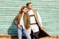 Fashion couple in glasses with glasses in green clothes posing o Royalty Free Stock Photo