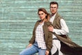 Fashion couple in glasses with glasses in green clothes posing o Royalty Free Stock Photo