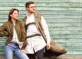 Fashion couple in glasses with glasses in green clothes posing o Royalty Free Stock Photo