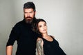 Fashion couple. couple in love. brutal bearded man and woman with tattoo. hairdresser and barbershop. tattoo salon. male