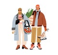 Fashion couple with shopping bags, preparing for winter holidays. Young man and woman holding Christmas purchases