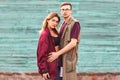 Fashion couple in their glasses with burgundy clothes posing on