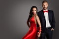 Fashion Couple, Woman and Man Arms Bounded by Ribbon, Red Dress Black Suit