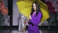 Posing attractive girl hold umbrella catwalk model show vogue. Woman on podium. Royalty Free Stock Photo
