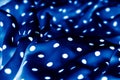 Classic polka dot textile background texture, white dots on blue luxury fabric design pattern Royalty Free Stock Photo