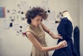 Fashion designer designing a black dress