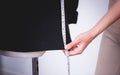 Fashion Designer hand measuring jacket with measuring tape Royalty Free Stock Photo