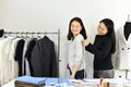 Fashion designer measures customer body size with measuring tape , Dressmaker design customized tailor pattern.