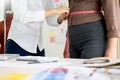 Fashion designer measuring on body part of women for a tailor ma Royalty Free Stock Photo