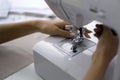 Fashion designer room, The tailor is checking the authenticity of the sewing machine. Closeup