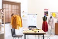 Fashion designer`s workplace in studio. Creating clothes Royalty Free Stock Photo