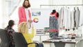 Fashion designer showing colleagues the color palette for the new collection Royalty Free Stock Photo