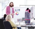 Fashion designer showing colleagues the color palette for the new collection Royalty Free Stock Photo