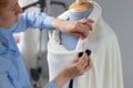 Fashion designer working with blue tailor dummy in her workshop Royalty Free Stock Photo