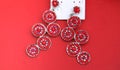 Fashion earings on red background Royalty Free Stock Photo