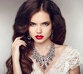 Fashion earrings and Necklace. Beauty girl portrait. Hairstyle.