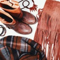 Fashion flat lay with autumnal clothing - scarf, boots, bag, bright wooden accessories. Beautiful cozy trend collection