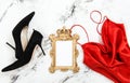 Fashion flat lay Red dress black high heels golden frame