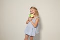 Fashion girl eats a candy lollipop cake Royalty Free Stock Photo