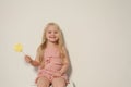 Fashion girl eats a candy lollipop cake Royalty Free Stock Photo