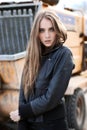 Fashion girl in a jacket next to the construction Royalty Free Stock Photo