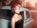 Fashion girl in retro style posing near old car Royalty Free Stock Photo