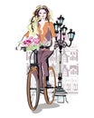 Fashion girl rides a bicycle