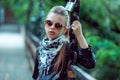 Fashion girl in suglasses poses outside Royalty Free Stock Photo