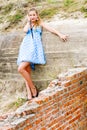Fashion girl urbex location blue polka dress Royalty Free Stock Photo