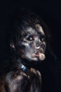 Fashion glamour portrait of a beautiful young caucasian woman. Black messy creative makeup. Dramatic dark image. The