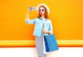 Fashion glamour woman takes a picture self portrait on smartphone Royalty Free Stock Photo