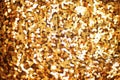 Fashion golden sequins, sparkling sequined textile. Gold background. Royalty Free Stock Photo