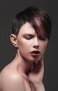 Fashion Haircut. Hairstyle. Stylish Fringe. Short Hair Style. Beautiful woman with multi-colored hair and Royalty Free Stock Photo