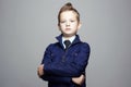 Fashion hairstyle child portrait. elegant kid in tie