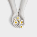 Fashion hand art chamomile natural cosmetics women, white beautiful chamomile flowers hand with bright contrast makeup, hand care Royalty Free Stock Photo