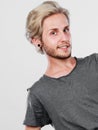 Happy smiling blonde man in grey t shirt Royalty Free Stock Photo