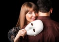 Fashion Happy Couple in Love holding with mask face Royalty Free Stock Photo