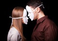 Fashion Happy Couple in Love holding with mask face Royalty Free Stock Photo