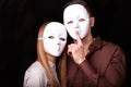 Fashion Happy Couple in Love holding with mask face Royalty Free Stock Photo
