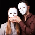 Fashion Happy Couple in Love holding with mask face Royalty Free Stock Photo