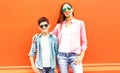 Fashion happy mother with son teenager in a sunglasses, checkered shirts Royalty Free Stock Photo