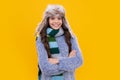 Fashion happy young woman in knitted hat and sweater having fun over colorful blue background. Happy face, positive and Royalty Free Stock Photo