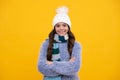 Fashion happy young woman in knitted hat and sweater having fun over colorful blue background. Happy girl face, positive Royalty Free Stock Photo