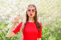 Fashion hippie woman having fun in flowering garden