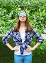 Fashion hippie woman in spring flowering garden